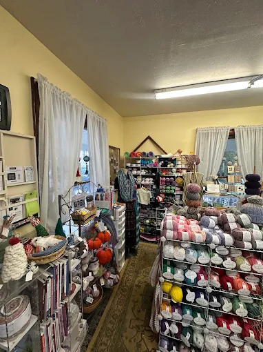 Yarn shelves, baskets, and project displays inside the shop